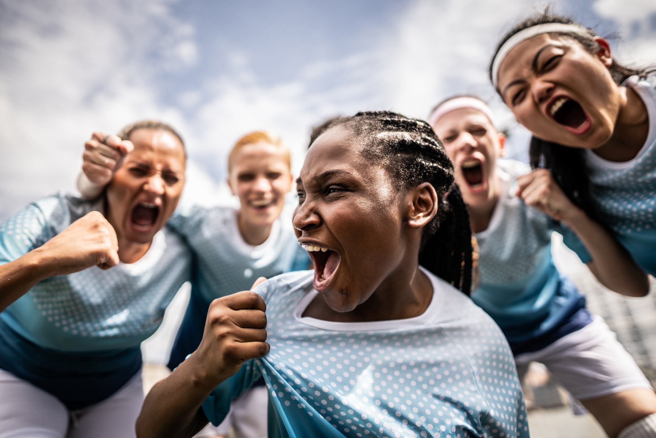  female soccer team celebrating