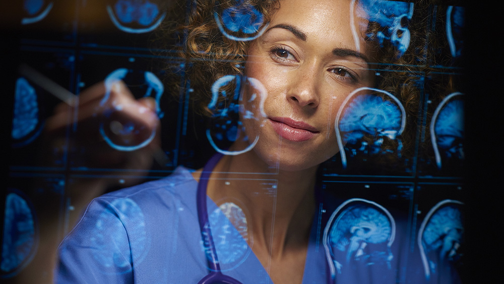 ALT Text: a medical practitioner looking at X-rays  